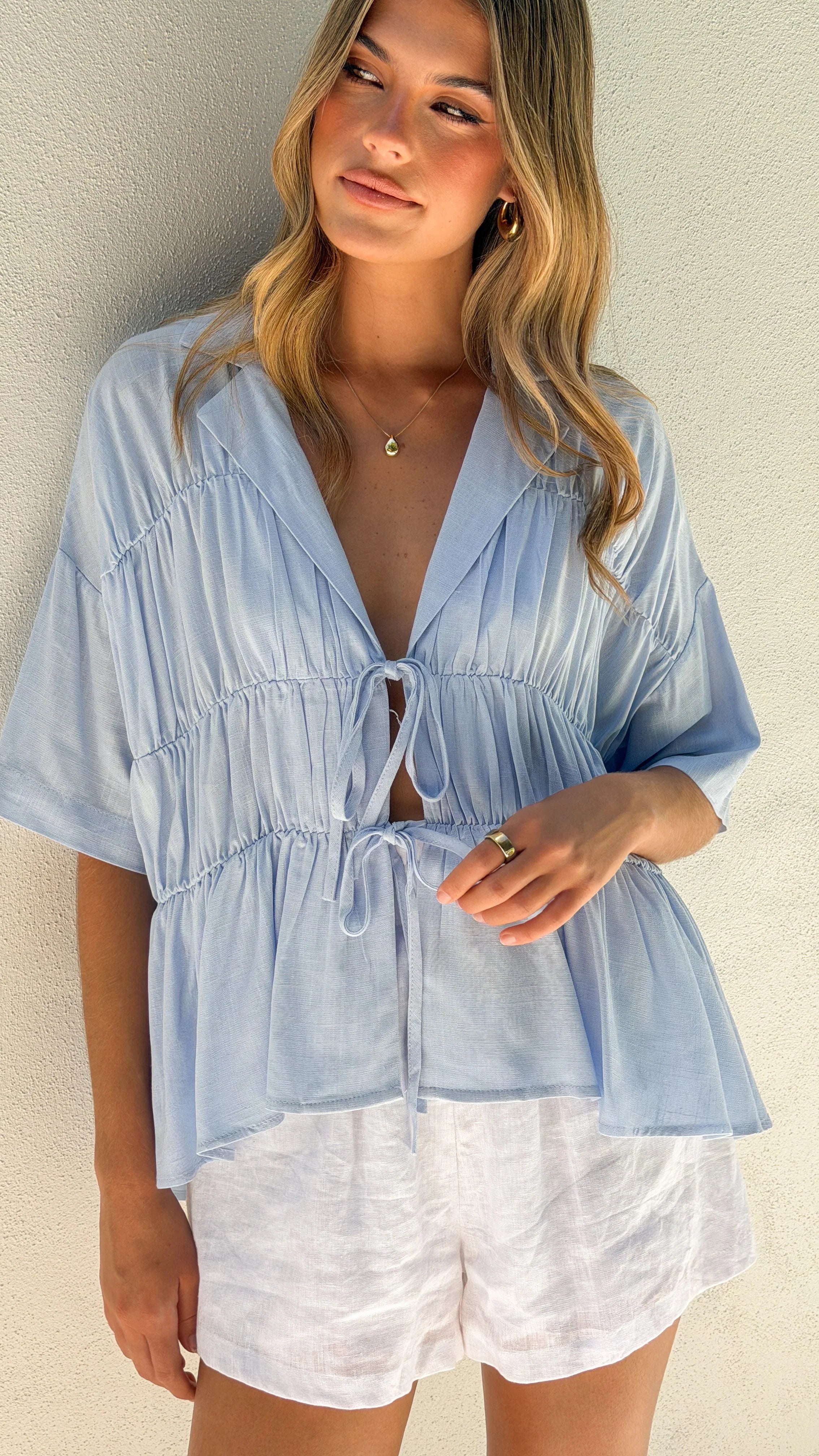 Women's tie-front peplum blouse with collared neckline