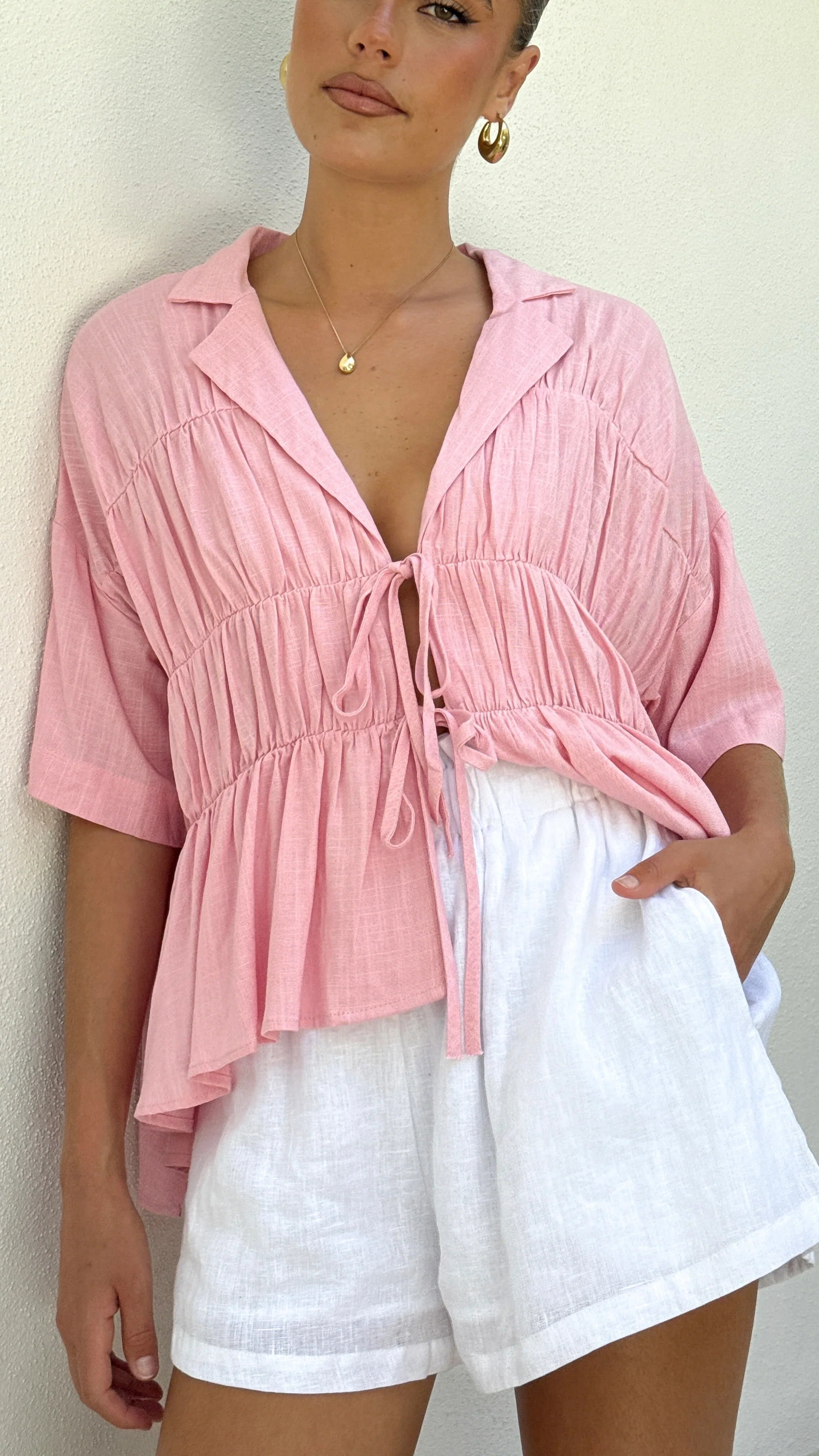Women's tie-front peplum blouse with collared neckline