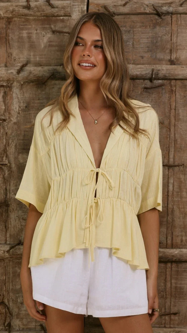 Women's tie-front peplum blouse with collared neckline