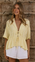 Women's tie-front peplum blouse with collared neckline