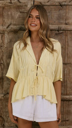 Women's tie-front peplum blouse with collared neckline