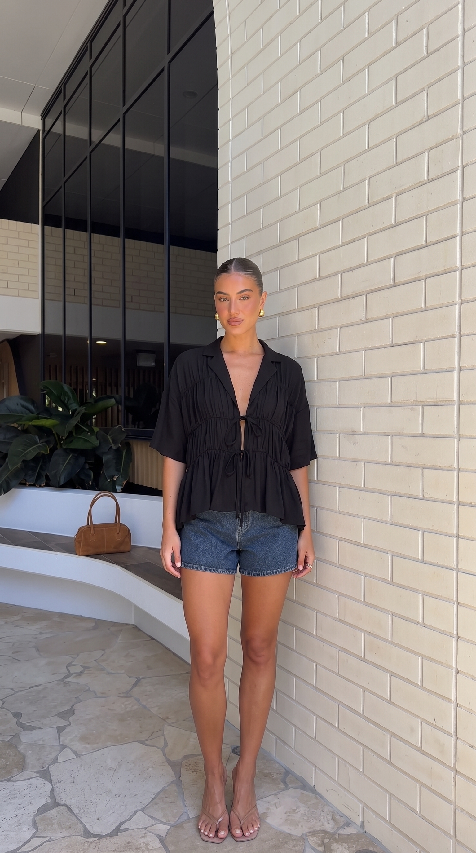 Women's tie-front peplum blouse with collared neckline
