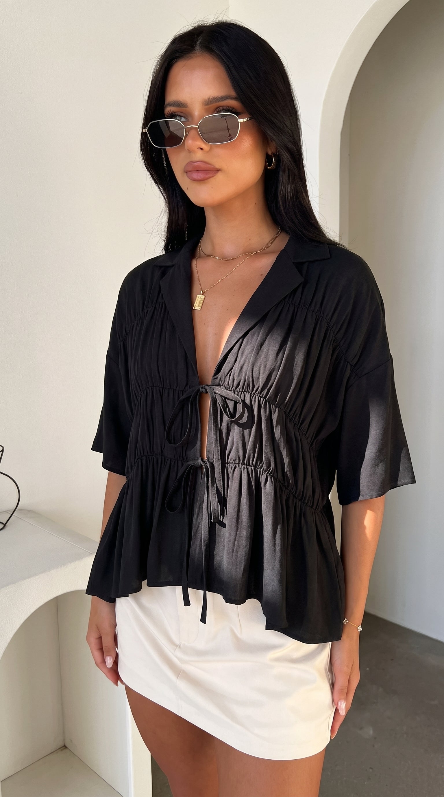 Women's tie-front peplum blouse with collared neckline