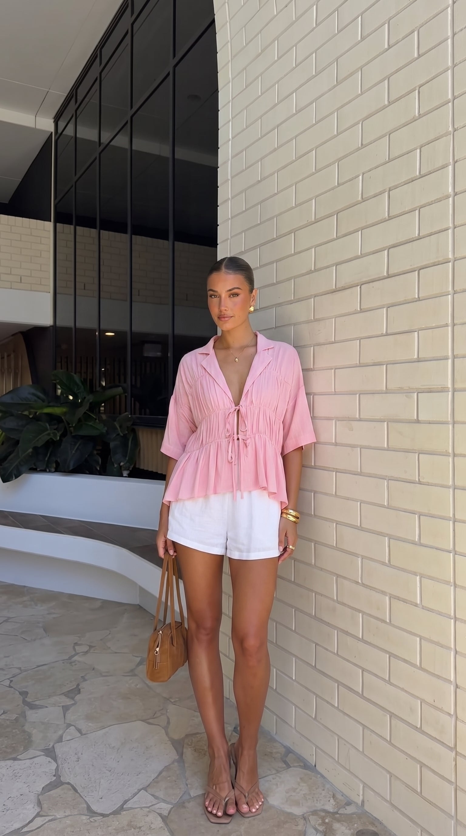 Women's tie-front peplum blouse with collared neckline