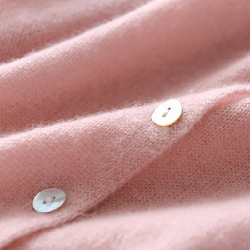 Women's asymmetric sweater with button detail