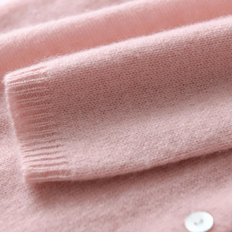 Women's asymmetric sweater with button detail