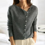 Women's asymmetric sweater with button detail
