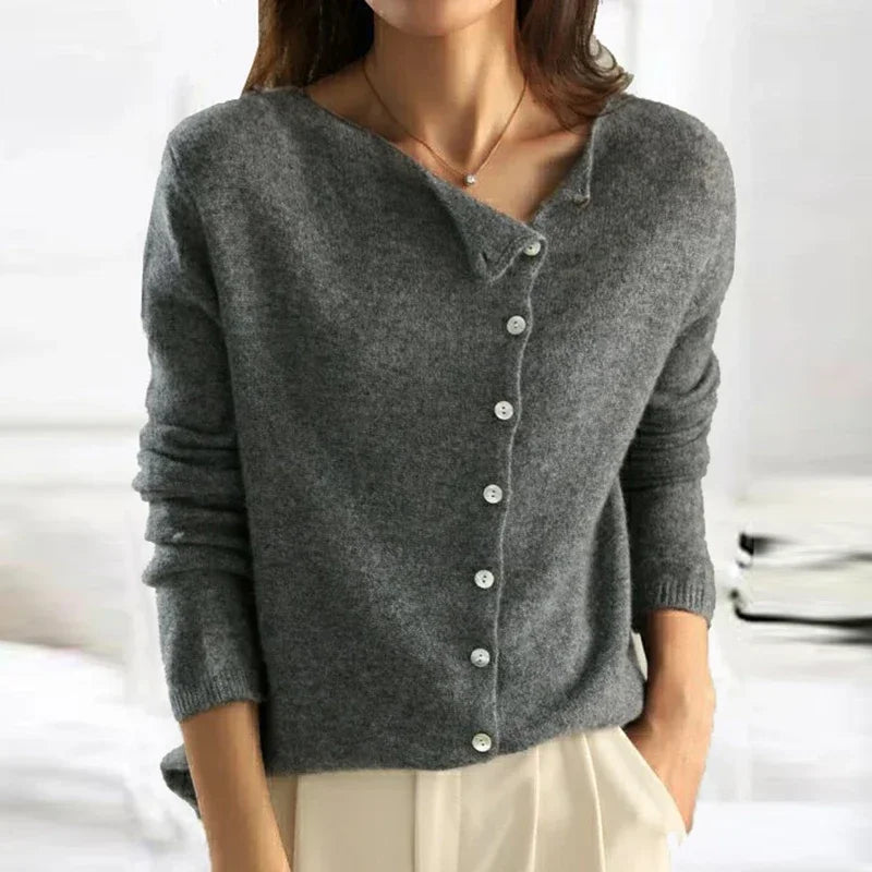 Women's asymmetric sweater with button detail