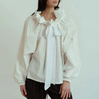 Women's blouse with puffed sleeves and fitted body