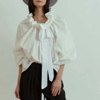 Women's blouse with puffed sleeves and fitted body