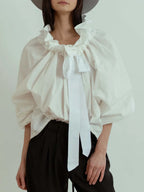 Women's blouse with puffed sleeves and fitted body