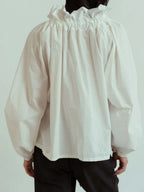Women's blouse with puffed sleeves and fitted body