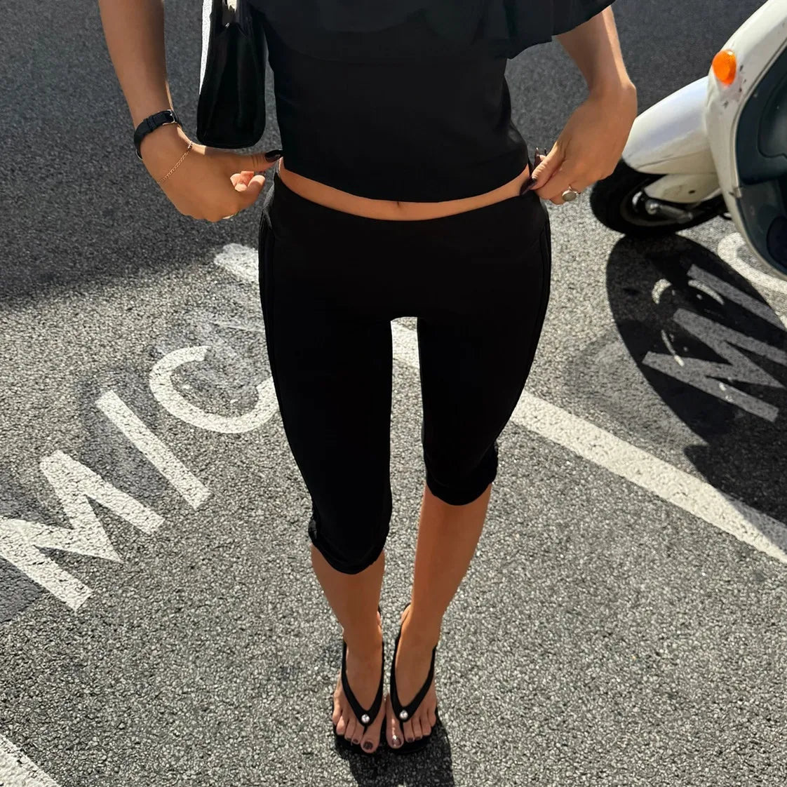 Women's fold-over waist capri leggings with split hem
