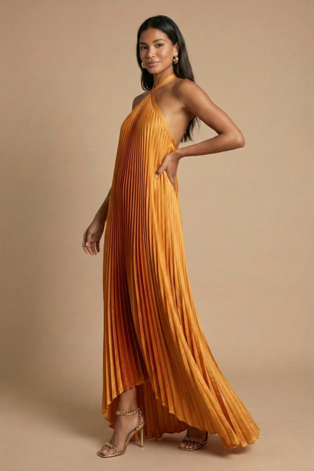 Women's halter neck maxi dress with open back and pleated skirt