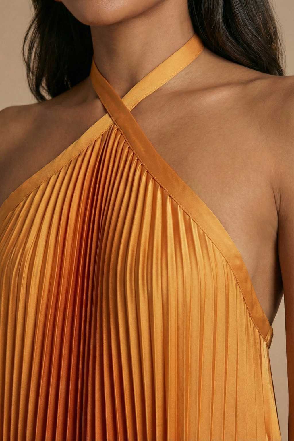 Women's halter neck maxi dress with open back and pleated skirt