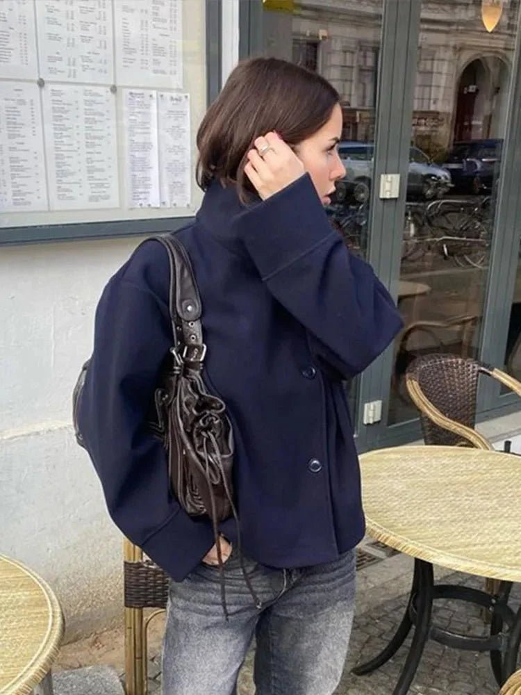 Women's jacket with stand-up collar and front fastening