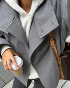 Women's jacket with stand-up collar and front fastening