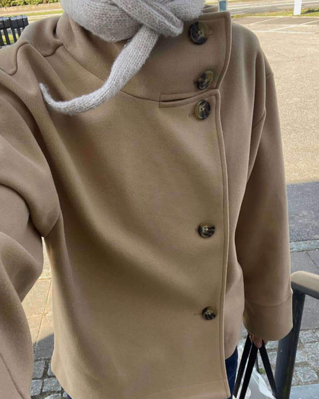 Women's jacket with stand-up collar and front fastening