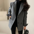 Women's longline tailored coat with button fastening
