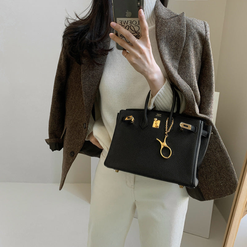 Women's longline tailored coat with button fastening