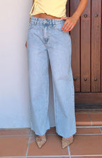 Women's mid-rise wide leg jeans with raw hem