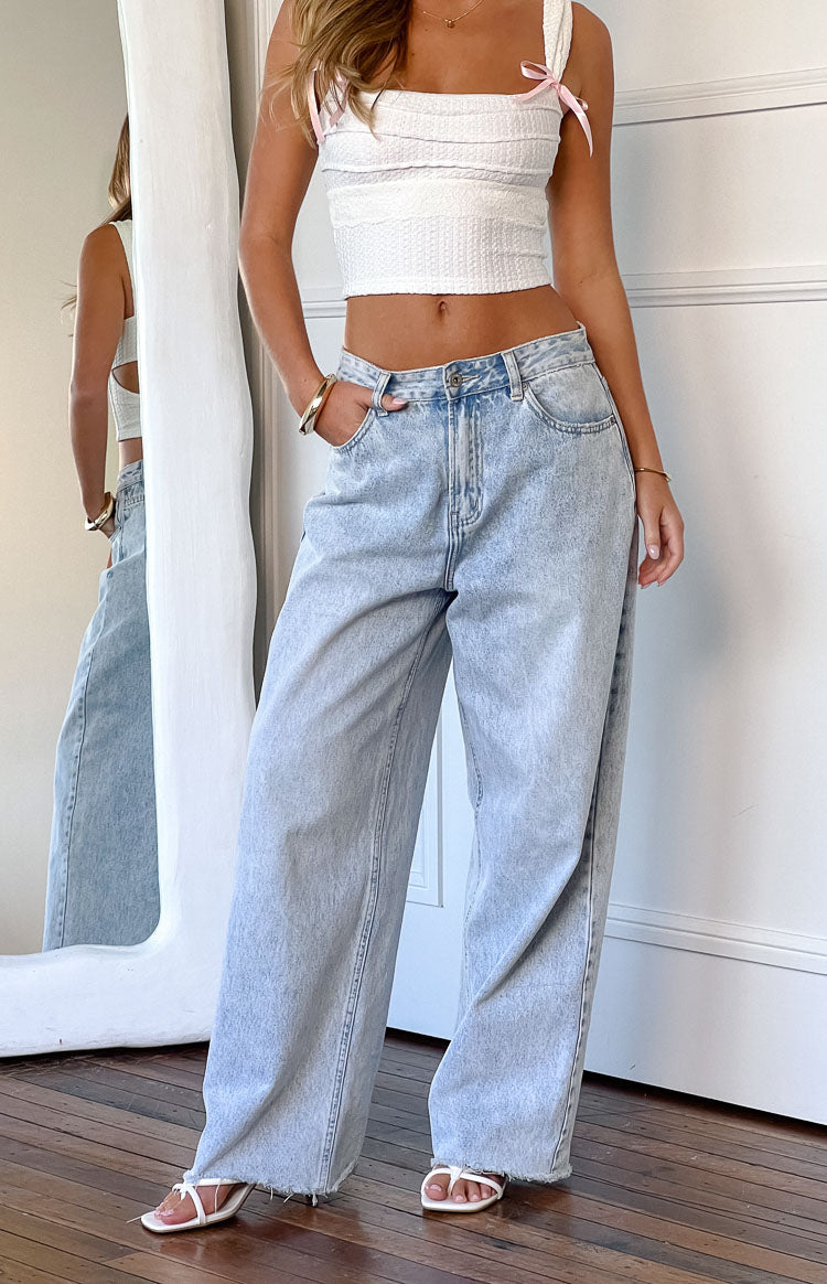 Women's mid-rise wide leg jeans with raw hem