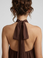 Women's mini dress with halter neck, open back and tiered ruffle hem