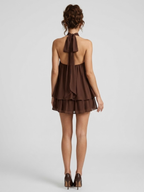 Women's mini dress with halter neck, open back and tiered ruffle hem