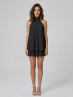 Women's mini dress with halter neck, open back and tiered ruffle hem