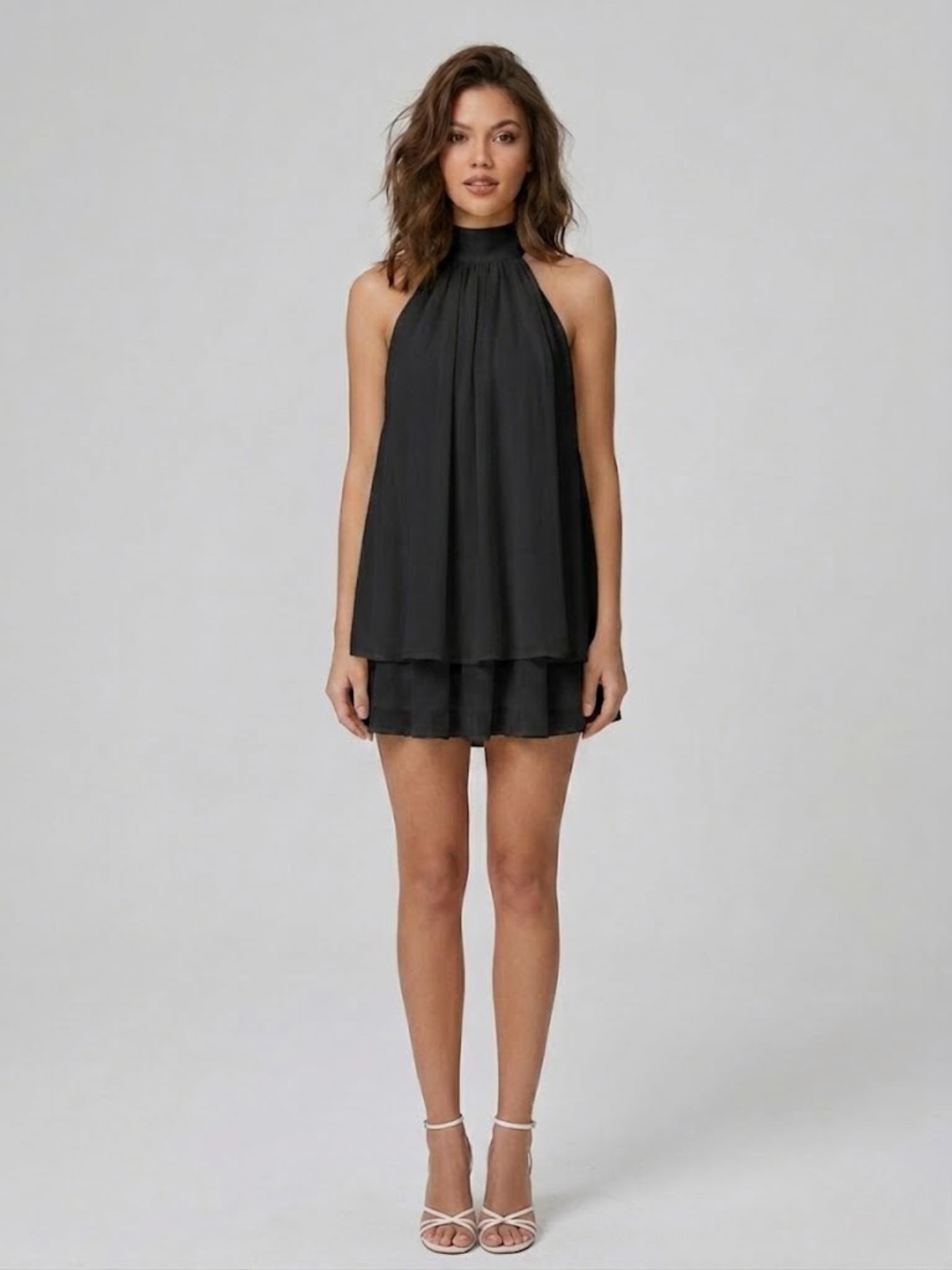 Women's mini dress with halter neck, open back and tiered ruffle hem
