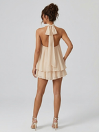 Women's mini dress with halter neck, open back and tiered ruffle hem