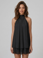 Women's mini dress with halter neck, open back and tiered ruffle hem