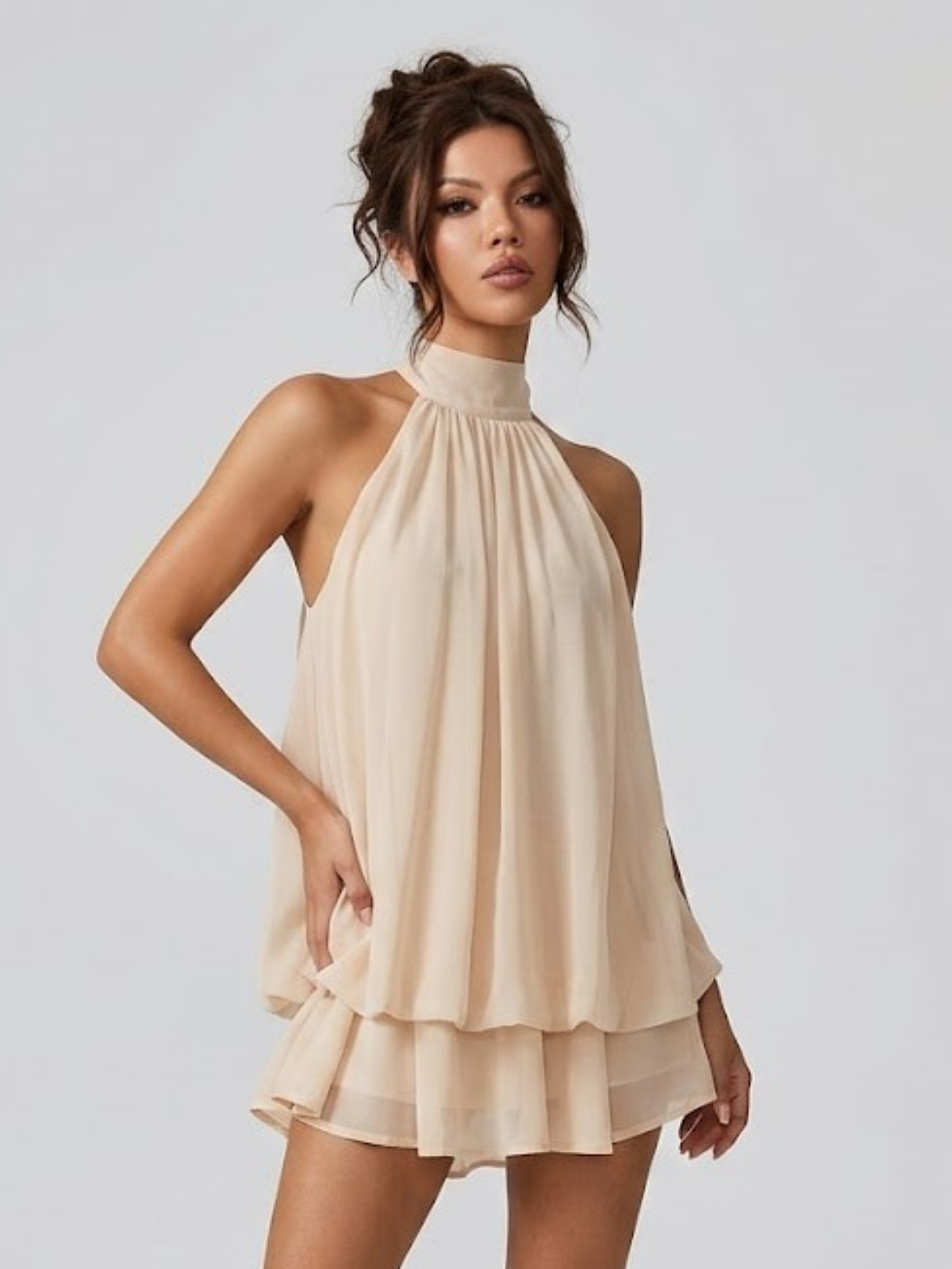 Women's mini dress with halter neck, open back and tiered ruffle hem