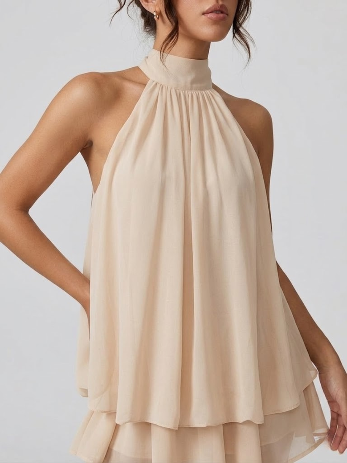 Women's mini dress with halter neck, open back and tiered ruffle hem
