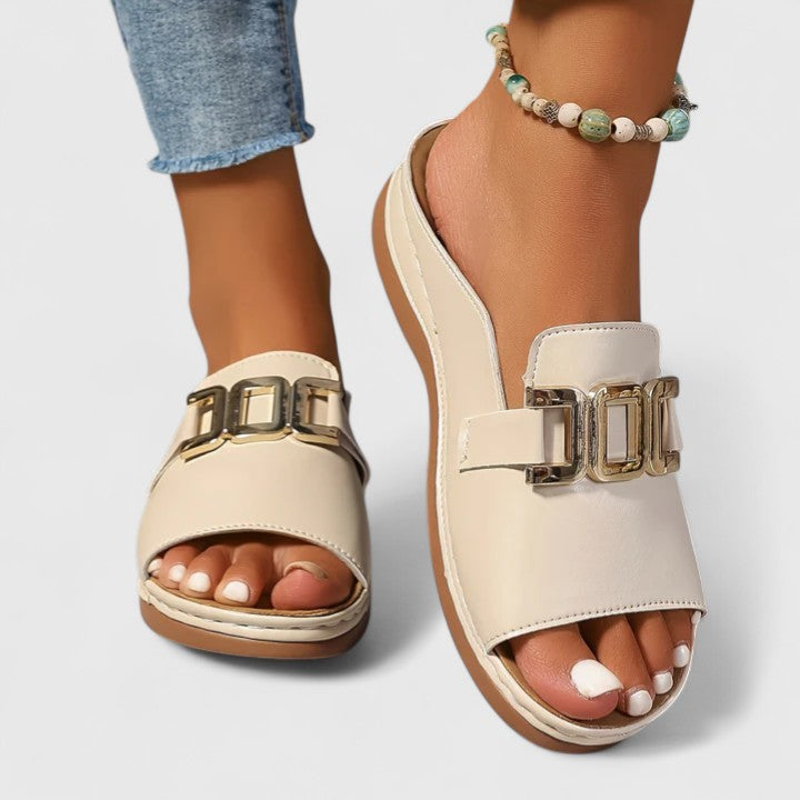 Women's open toe flat sandals with gold hardware detail