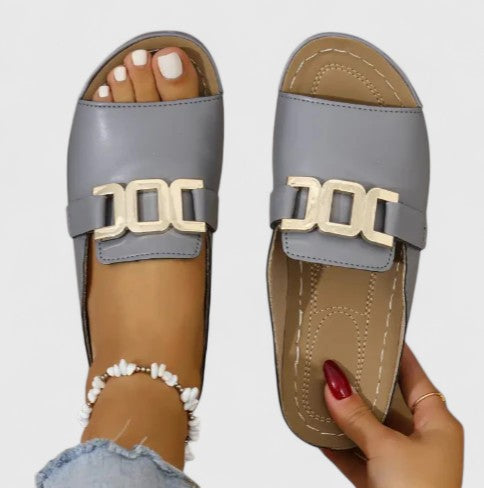 Women's open toe flat sandals with gold hardware detail