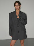 Women's oversized blazer with button fastening