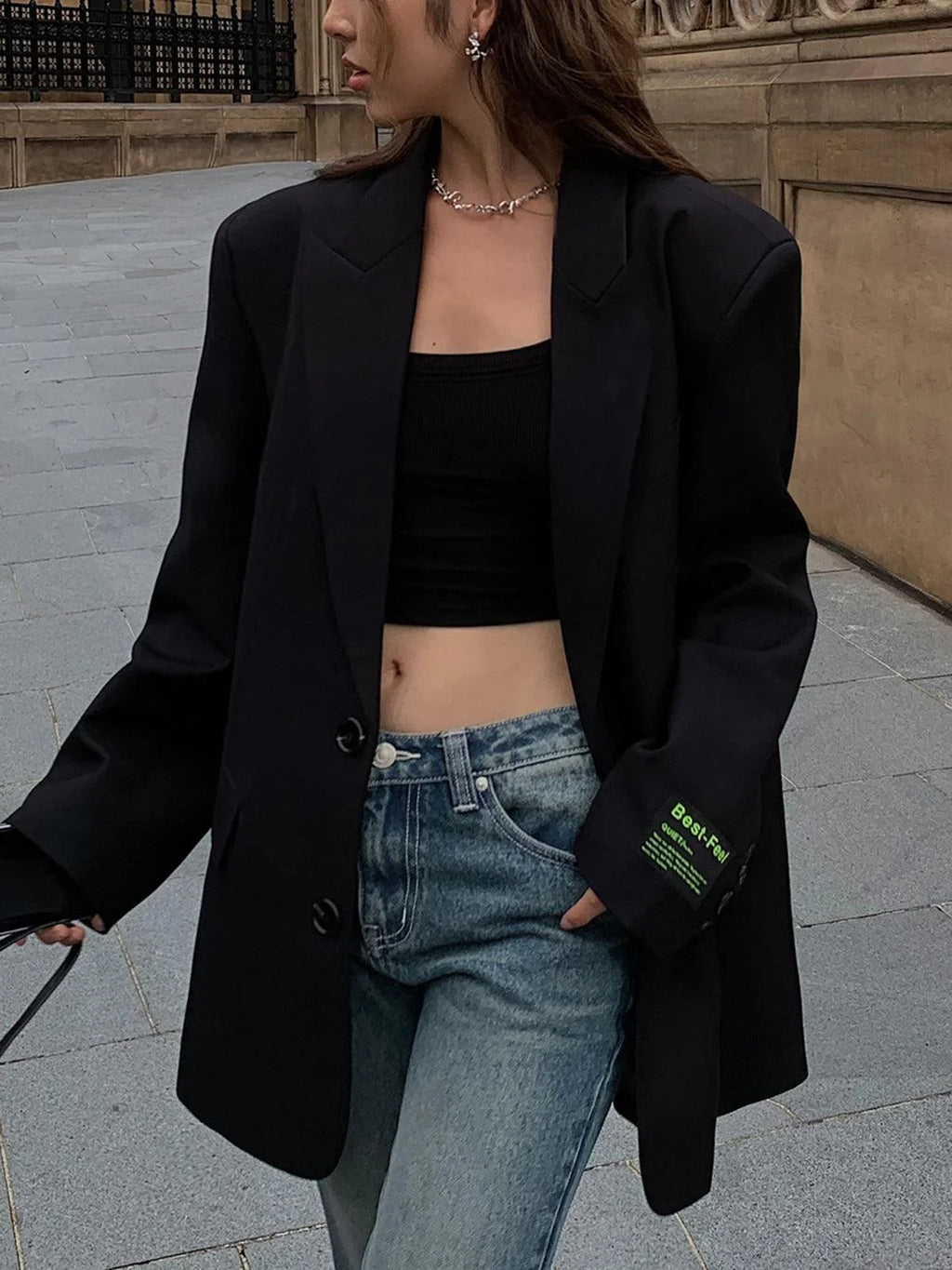 Women's oversized blazer with button fastening