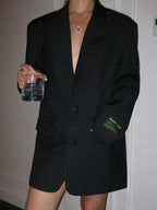 Women's oversized blazer with button fastening