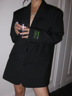 Women's oversized blazer with button fastening