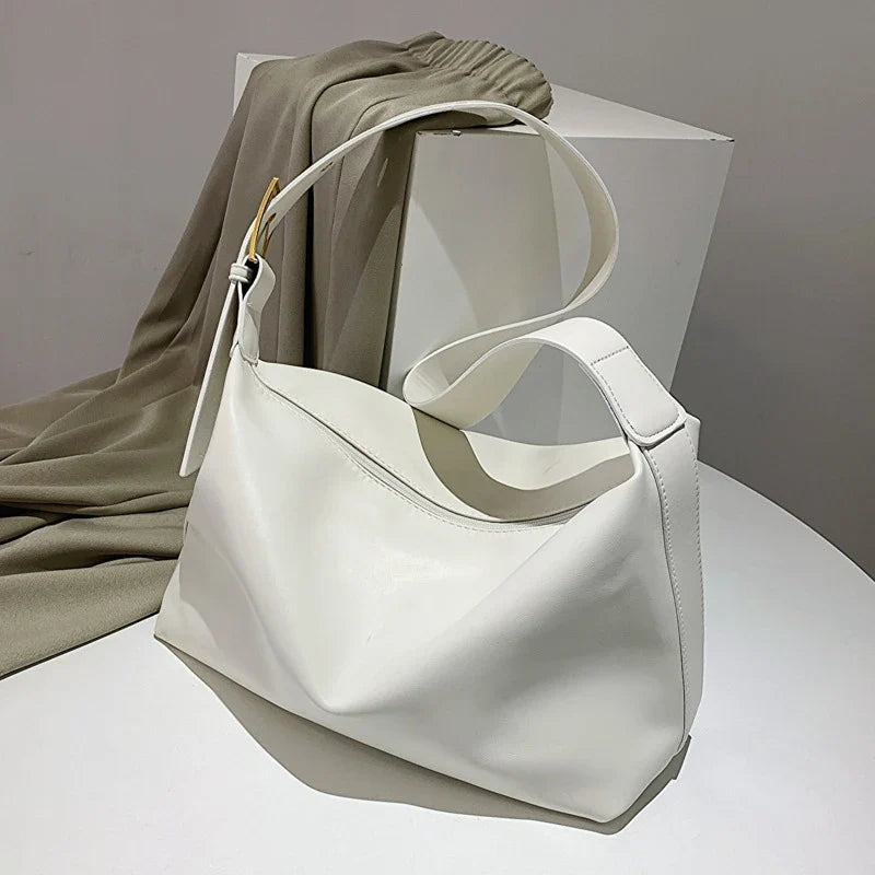 Women's oversized structured shoulder tote bag with buckle strap detail