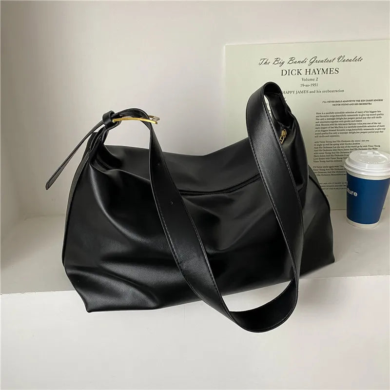Women's oversized structured shoulder tote bag with buckle strap detail