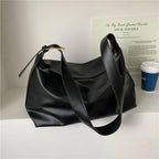 Women's oversized structured shoulder tote bag with buckle strap detail