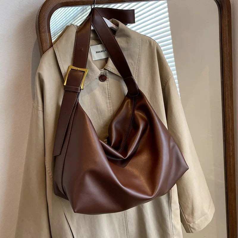 Women's oversized structured shoulder tote bag with buckle strap detail