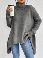Women's oversized turtleneck sweater with asymmetric hem and batwing sleeves