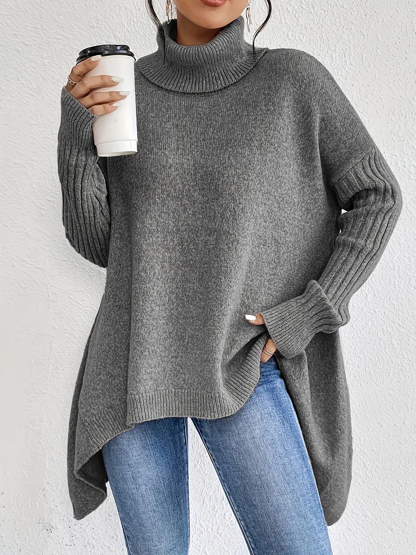 Women's oversized turtleneck sweater with asymmetric hem and batwing sleeves