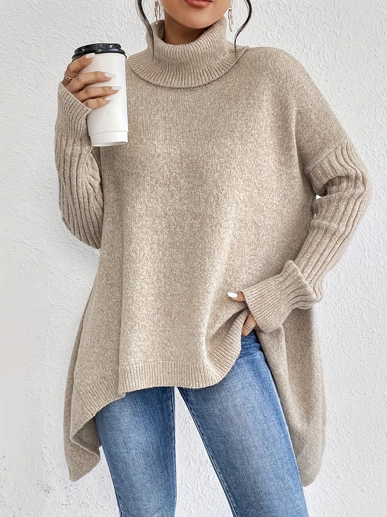 Women's oversized turtleneck sweater with asymmetric hem and batwing sleeves
