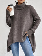 Women's oversized turtleneck sweater with asymmetric hem and batwing sleeves