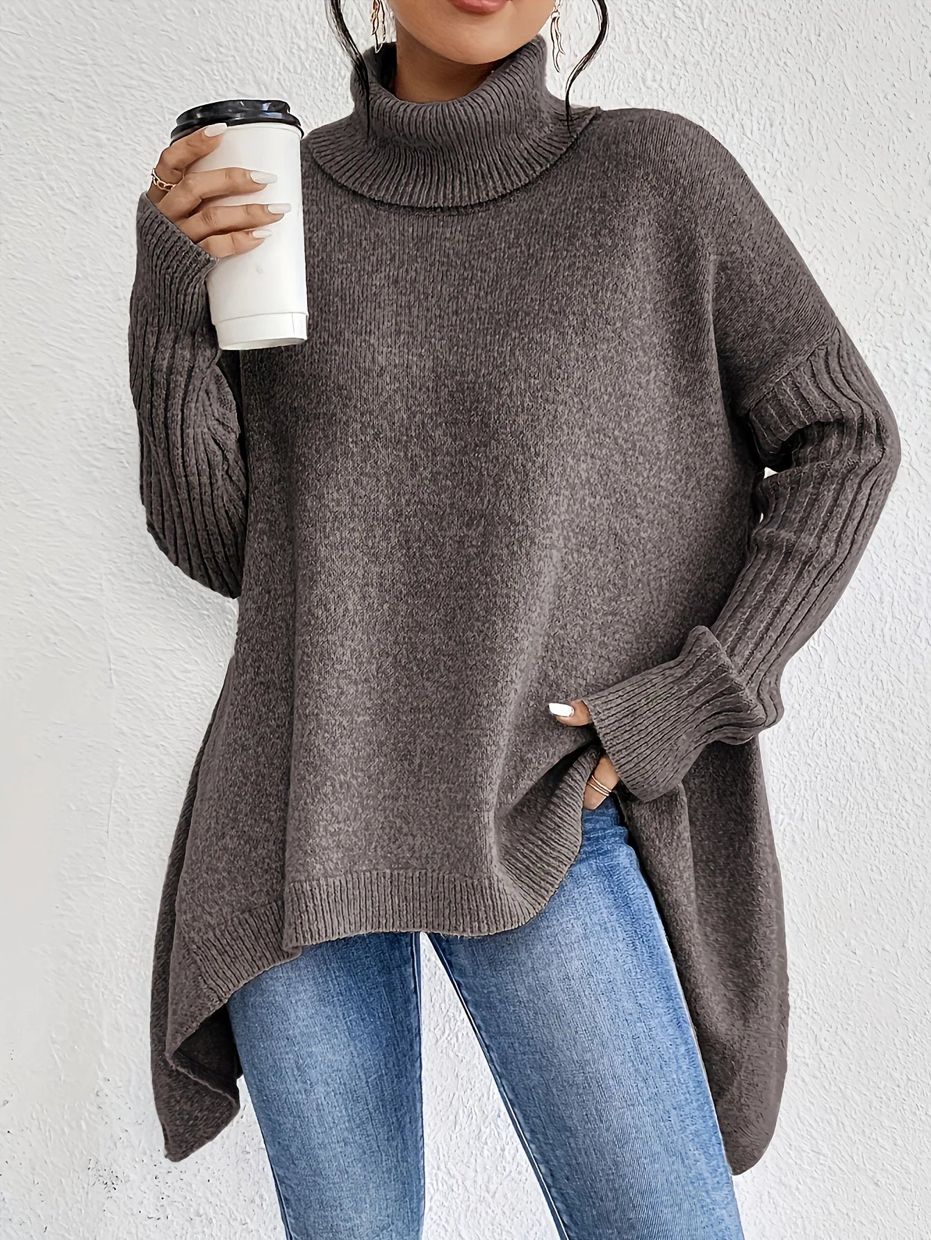 Women's oversized turtleneck sweater with asymmetric hem and batwing sleeves