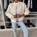 Women's quilted zip-front bomber jacket with long sleeves